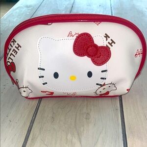 Hello Kitty NWOT white and red faux leather cosmetic bag.
